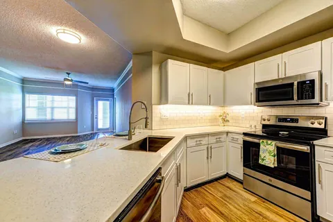 Flour kitchen, apartment community refaced with a Qwikkit cabinet refacing kit