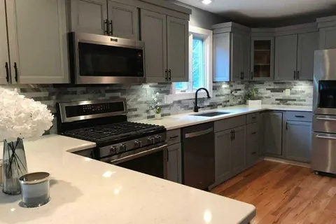 Step Shaker kitchen with island refaced with a Qwikkit cabinet refacing kit