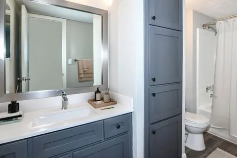 Two-tone bath vanity refaced with a Qwikkit cabinet refacing kit