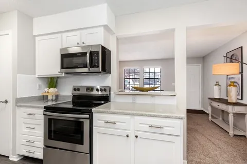 White kitchen refacing refaced with a Qwikkit cabinet refacing kit